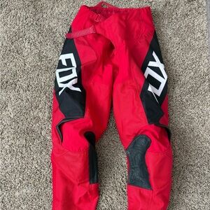 Red and black boys Fox motocross pants. Size 10-26.